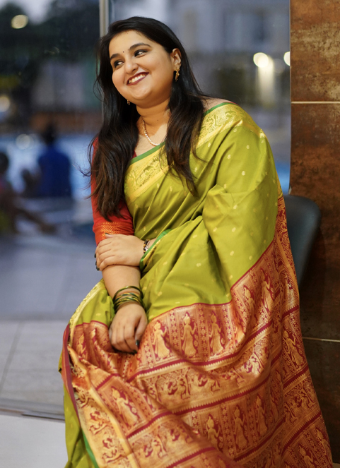 Woman in purple Kanchipuram saree